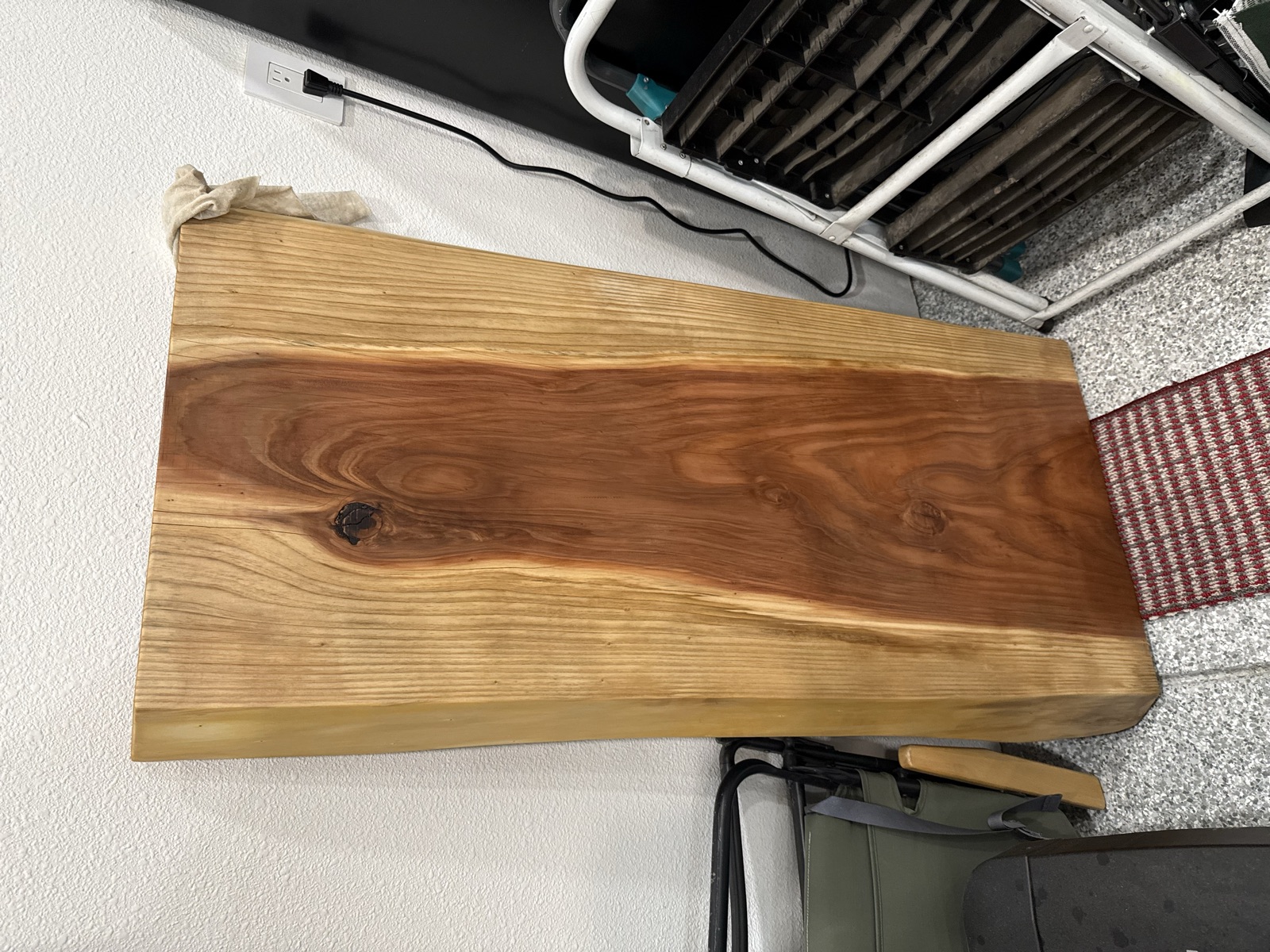The finished slab leaning against the garage wall to dry