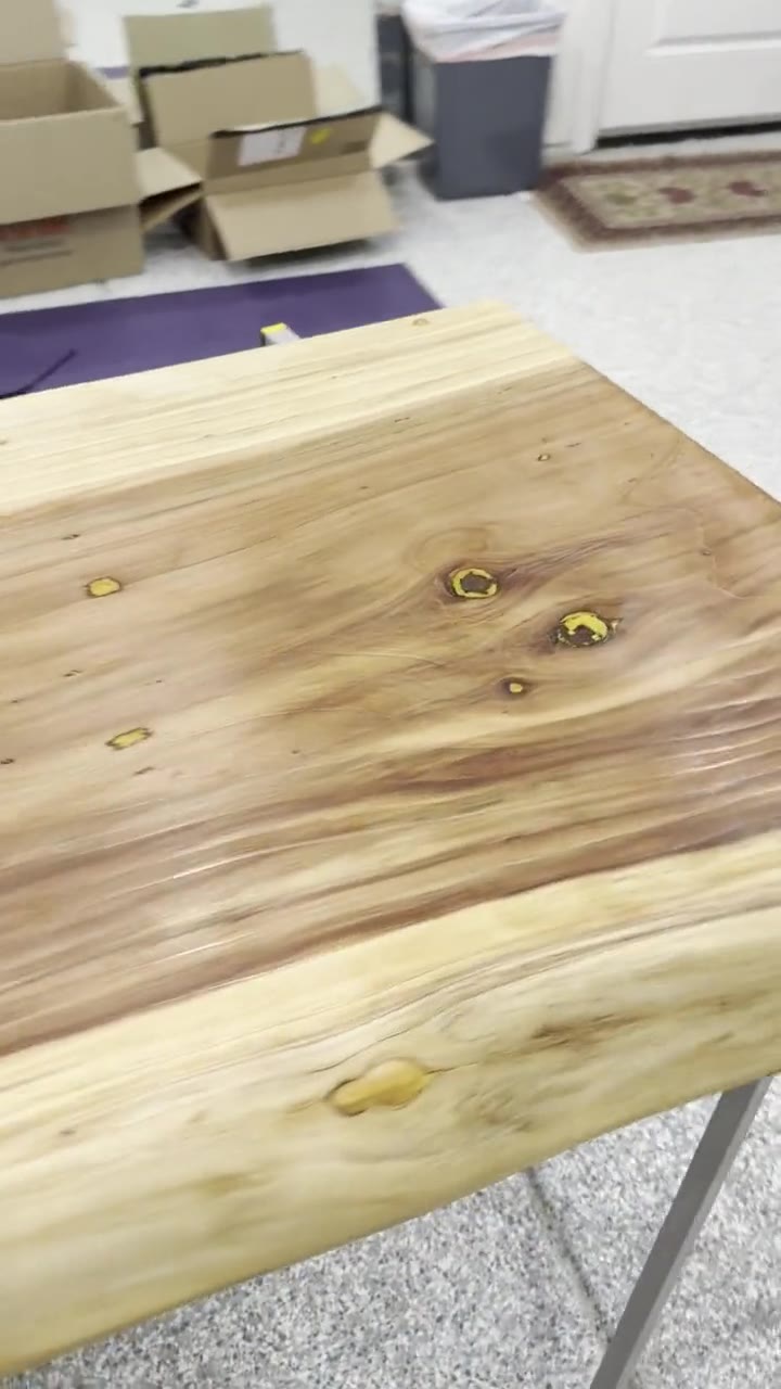 The finished second table with gold epoxy fills and thin steel legs