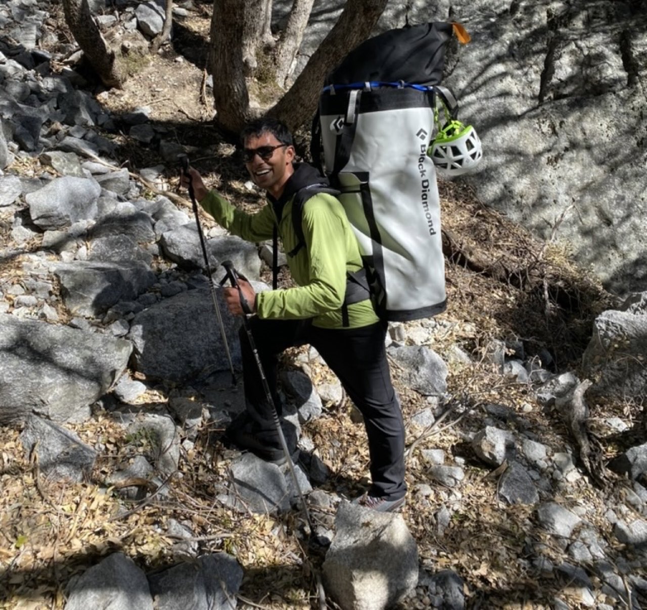 A portaledge hanging off a big wall route, with haul bags below