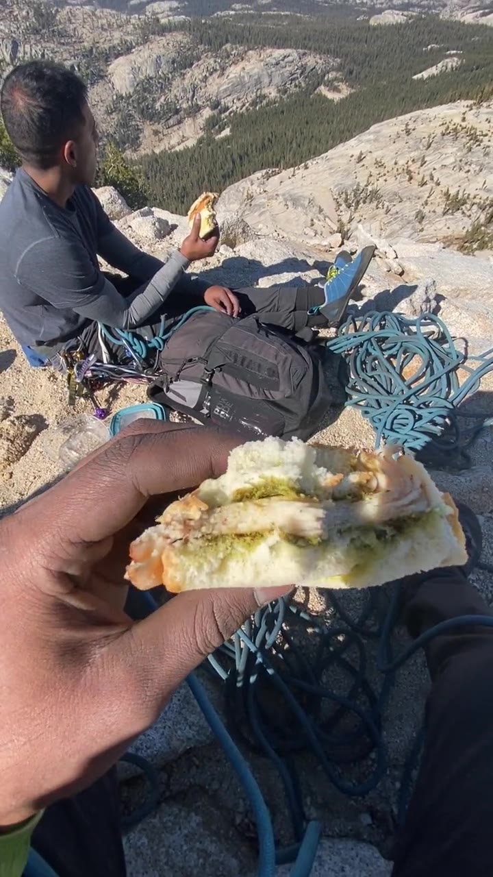 Eating a pesto chicken sandwich on the summit