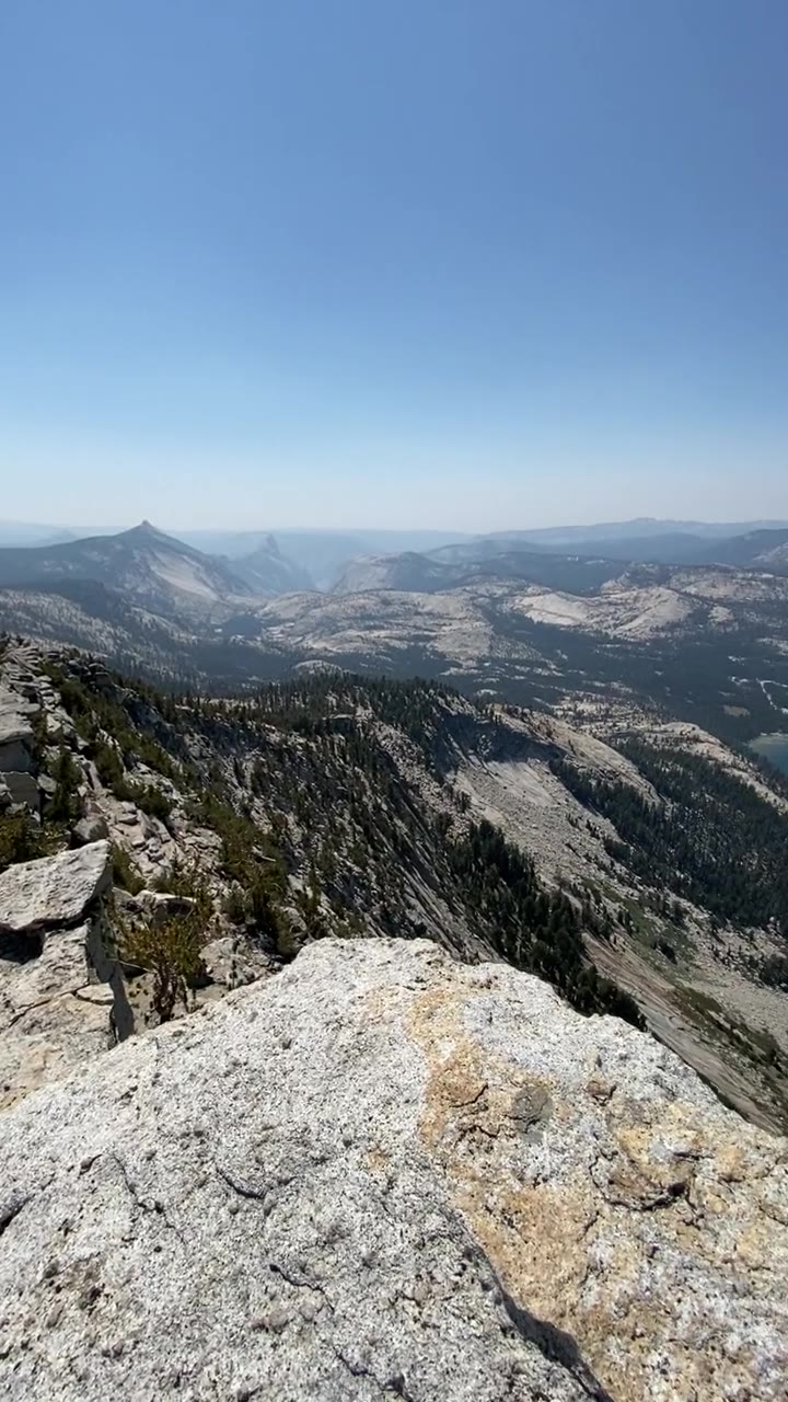 Looking out from the cliff edge toward Cathedral Peak