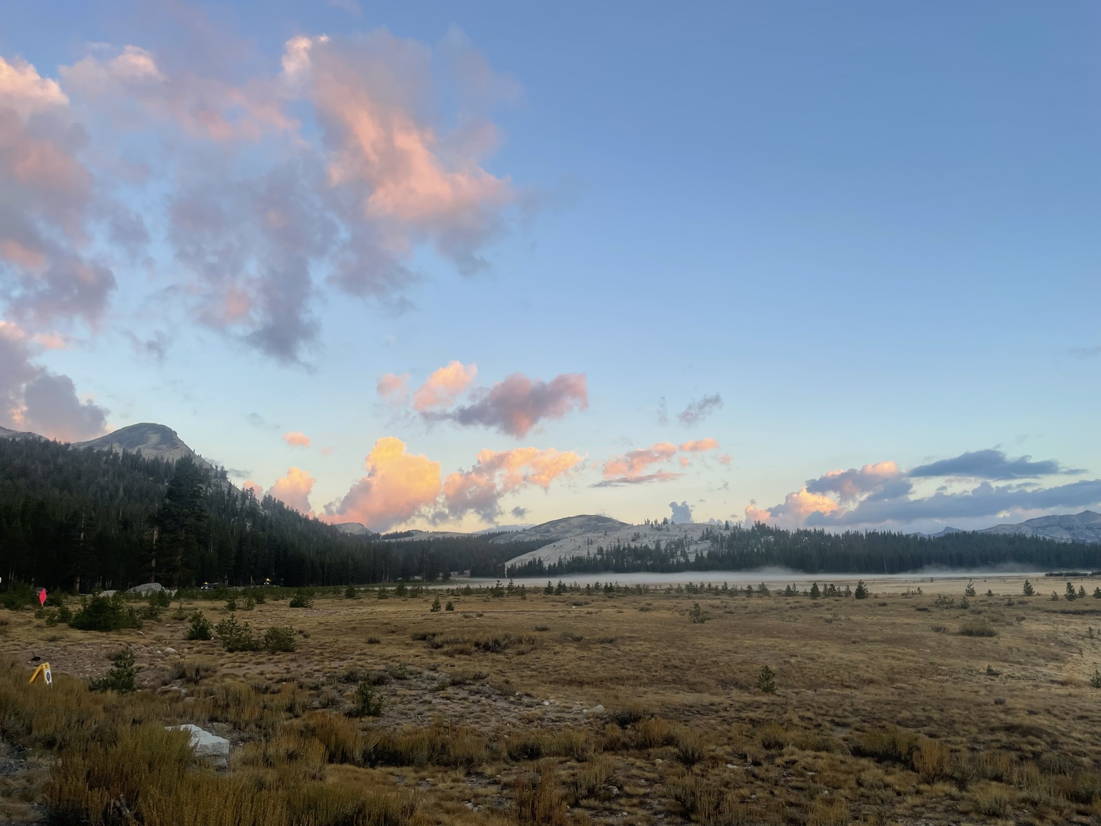 Tuolumne Meadows at sunset, mist on the valley floor