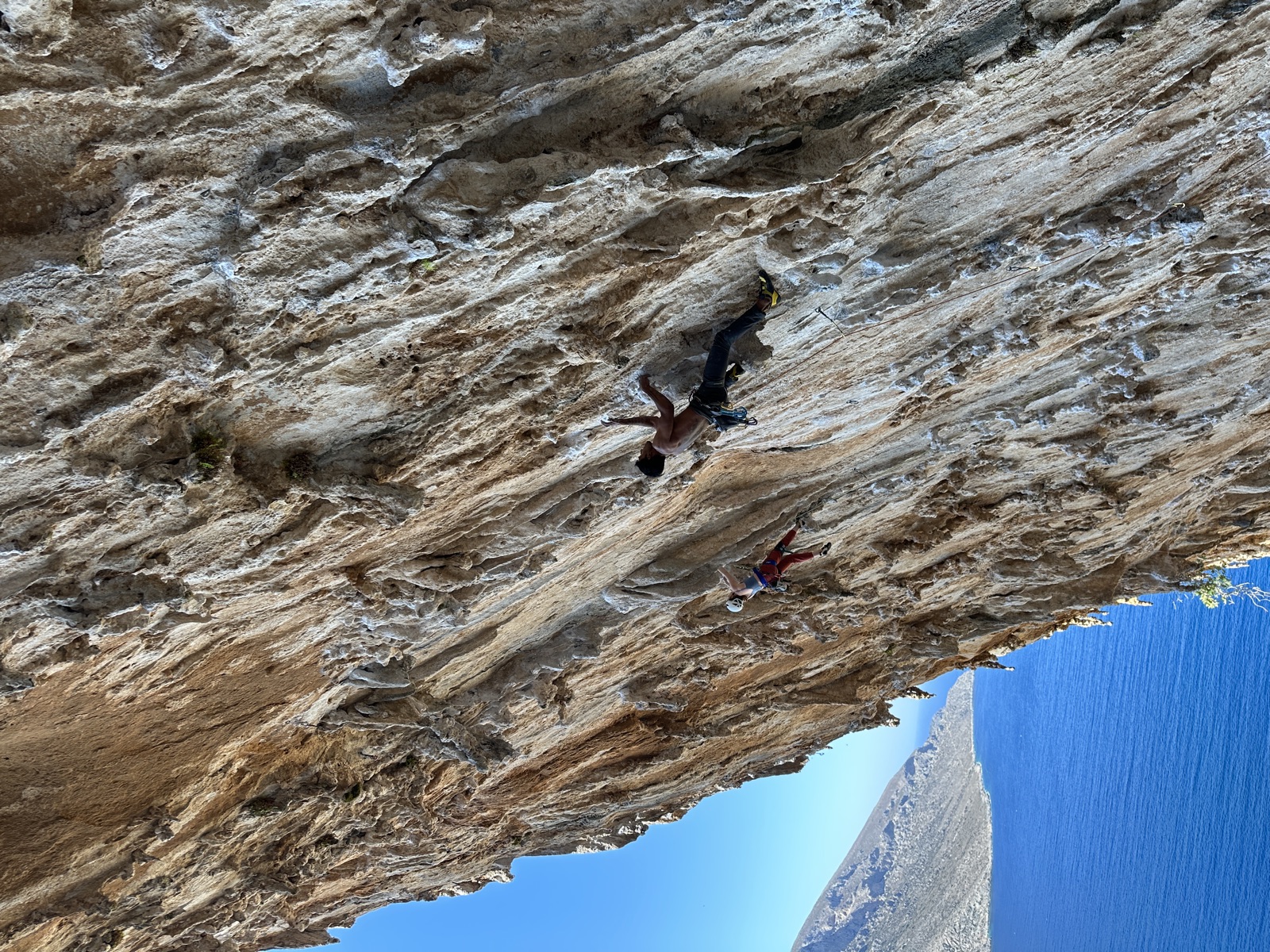 Looking up the overhanging tufa wall of DNA, a second climber lower on a neighboring line