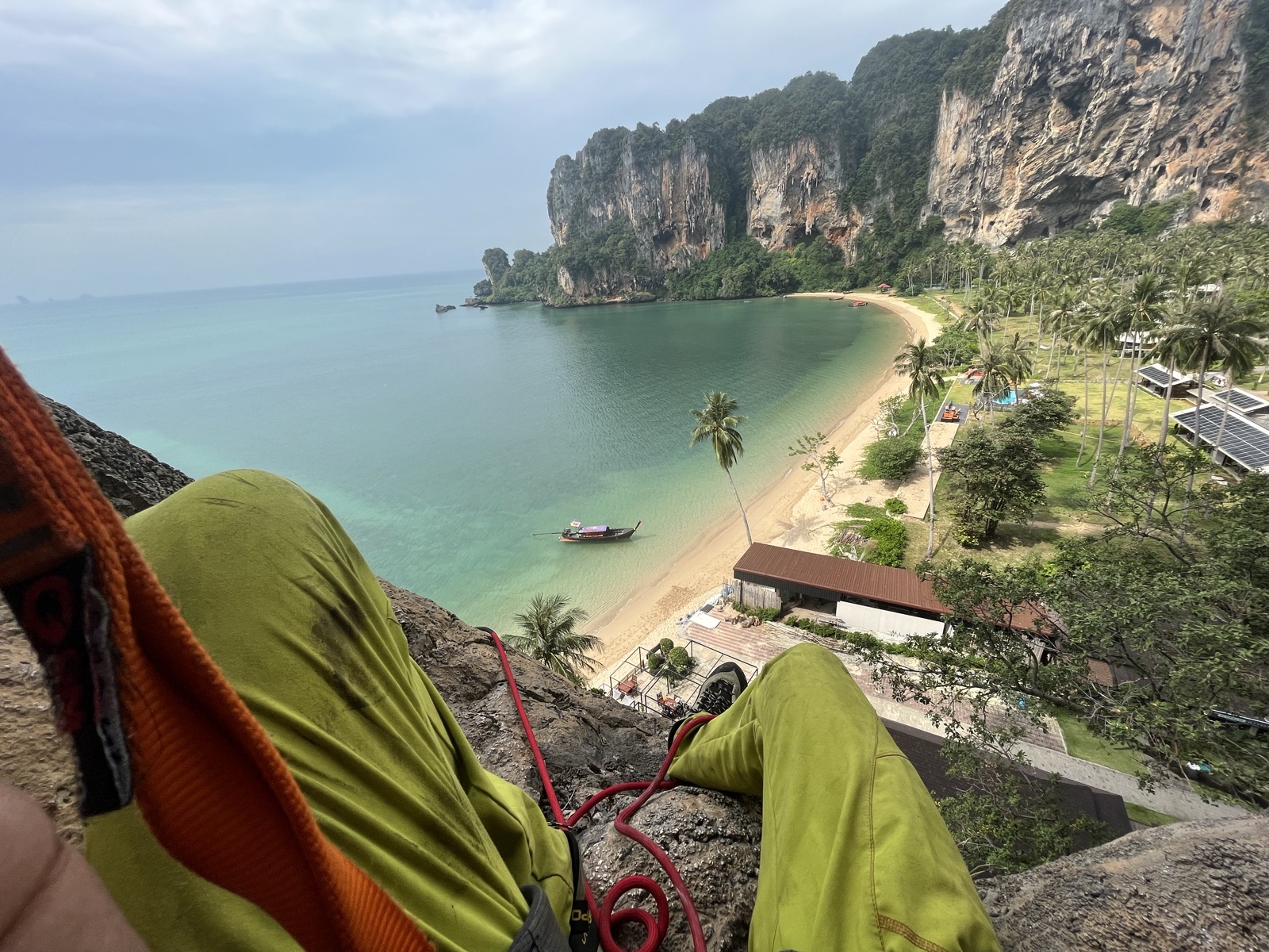 Climbing an overhanging limestone wall right off the beach in Tonsai