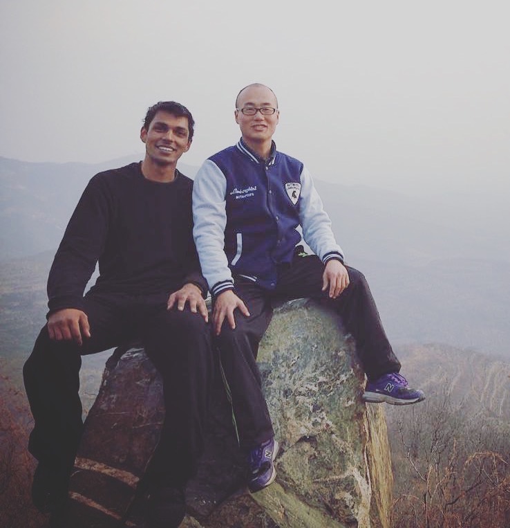 Sitting on a boulder beside my Sifu on a hazy mountainside